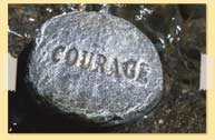 Image of Courage etched on a rock