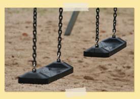 Image of empty playground swings